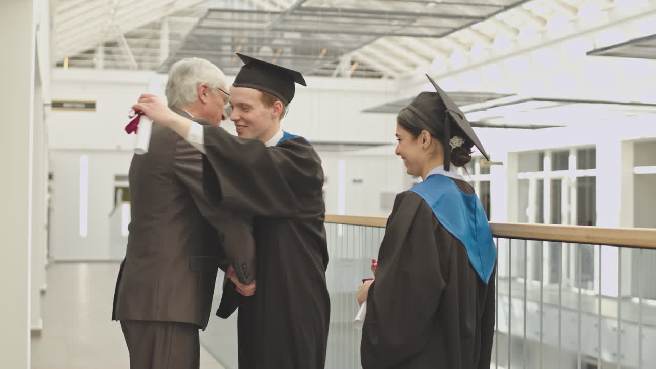 University Tutor Congratulating Graduates