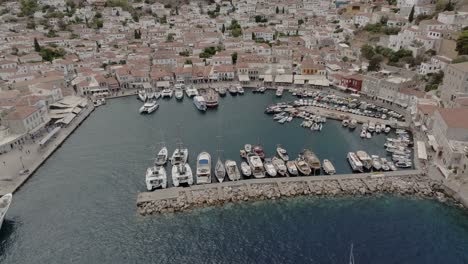 aerial reveal of hydra port in hydra island, greece