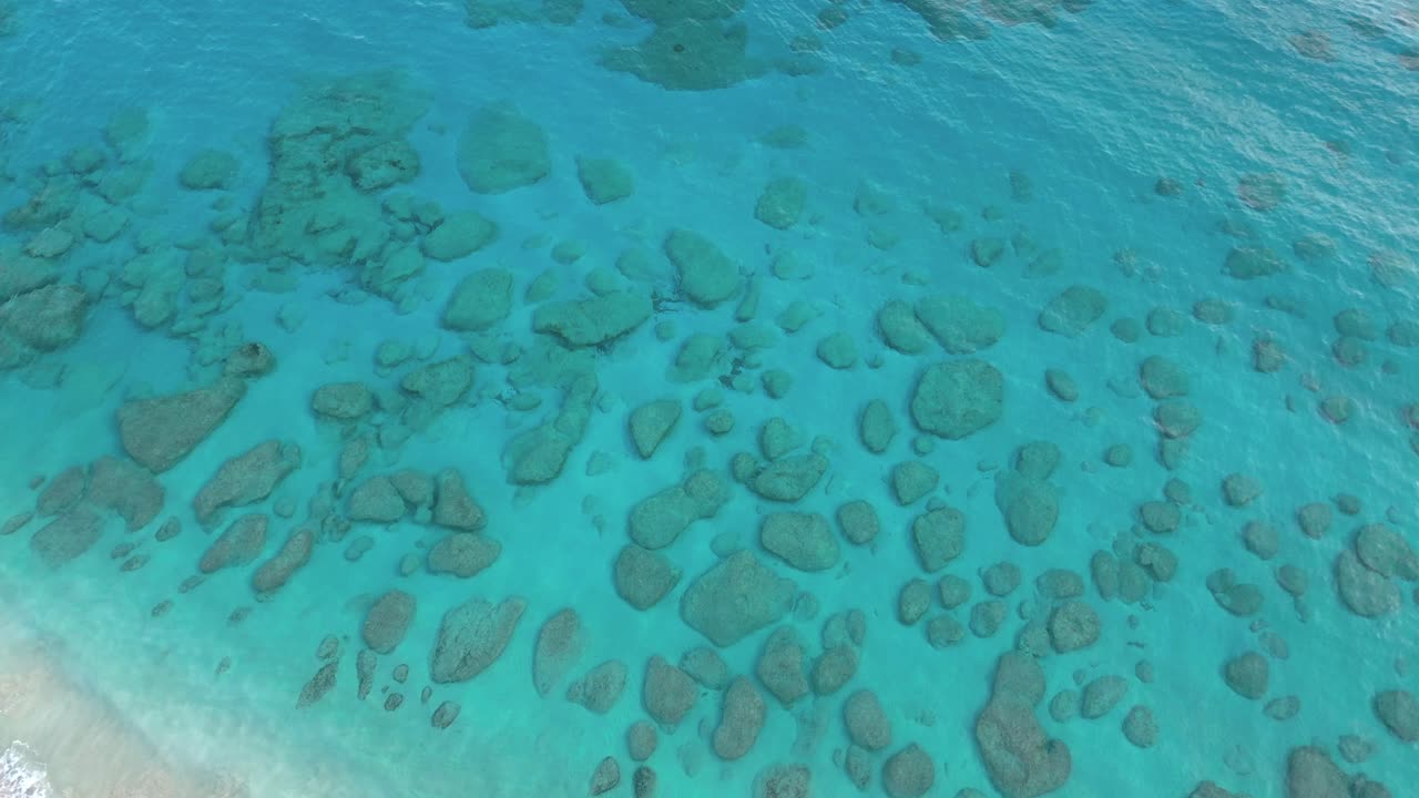 Incredible turquoise color of Playa Chencho exotic ocean water in Dominican Republic