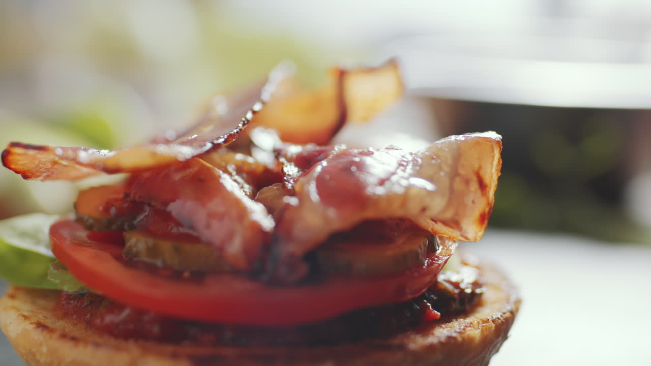 Putting Bacon Slice on Burger