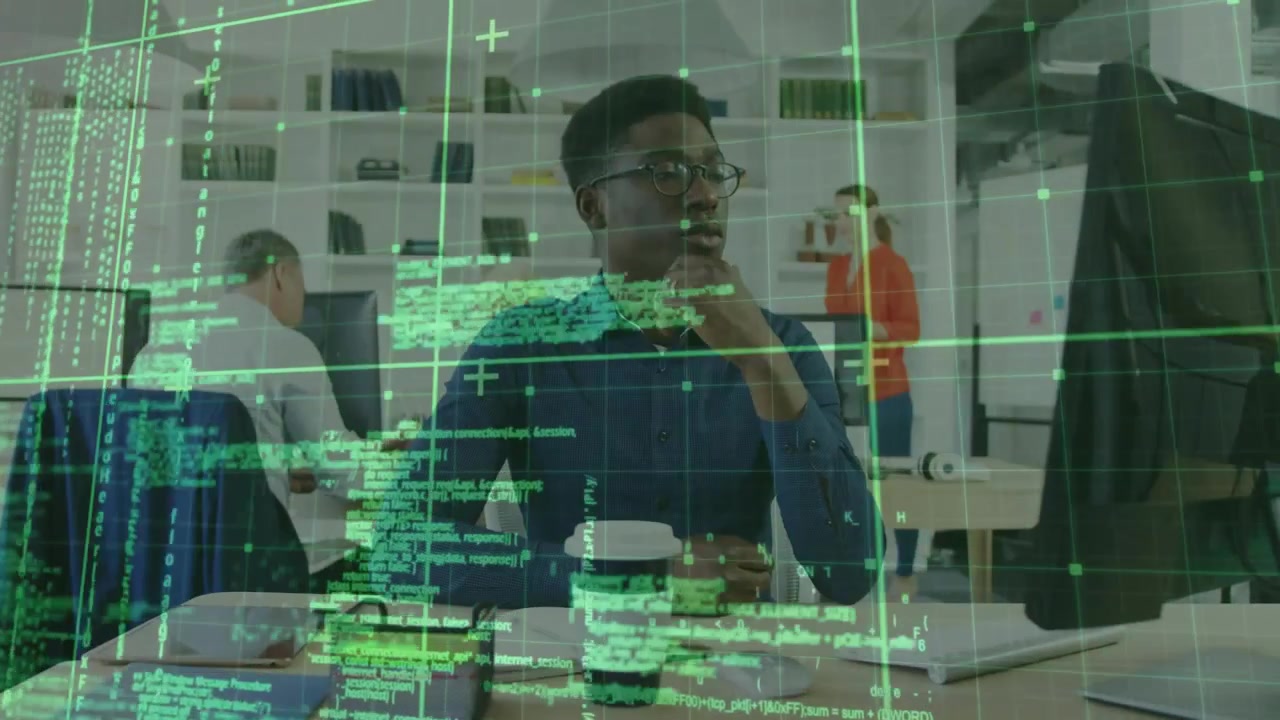 Engineer typing code activating overlay, colleague pointing at whiteboard guiding debugging