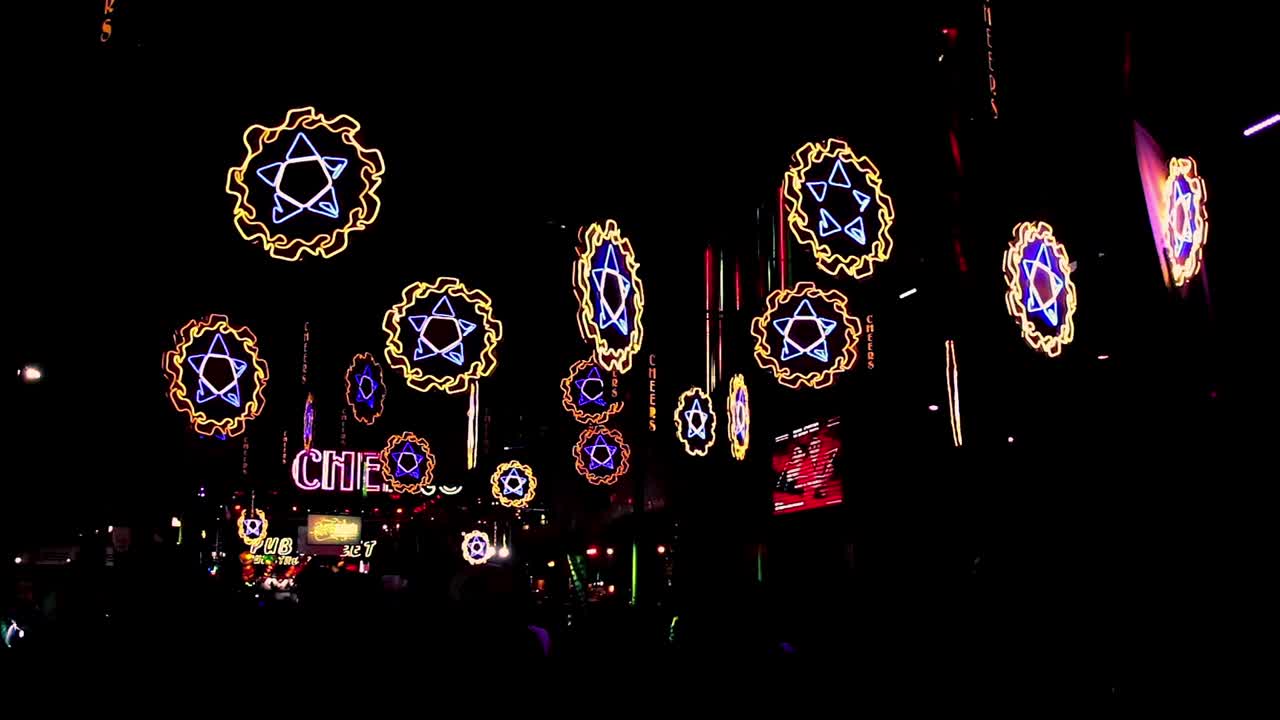 Editorial. Silhouette of crowd celebrating Khmer New Year also known as Choul Chnam Thmey and Moha Sangkranta or just Sangkranta in the famous Pub Street