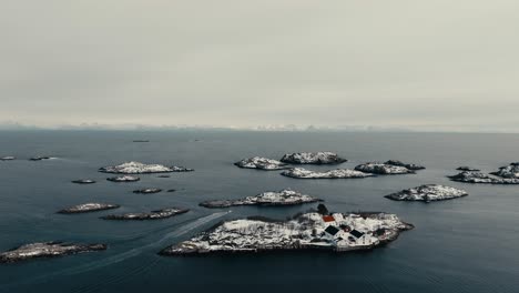 henningsvaer village during winter in norway - aerial shot