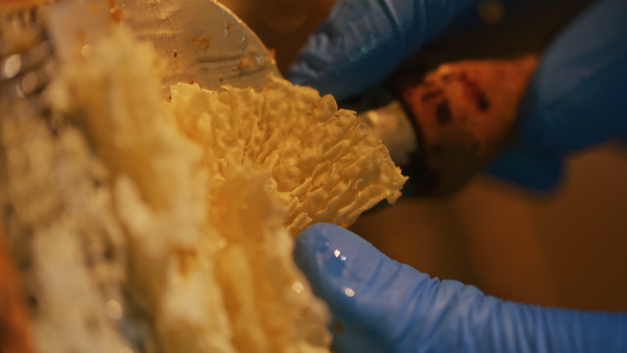 The Beekeeper Strips Wax and Produces Honey