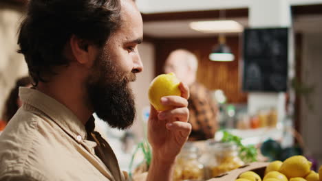 man elated to smell farm grown fruits