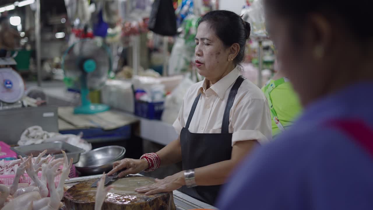 Woman Selling Chicken at a Market