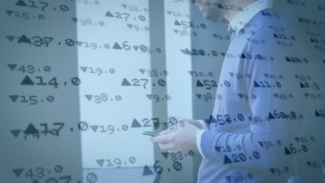 Animation-of-trading-board-over-caucasian-man-using-cellphone-and-looking-through-window-at-office