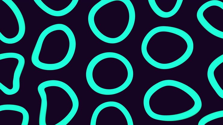Black and yellow pattern of overlapping circles and ovals on dark background