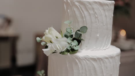 textured wedding cake with floral accent