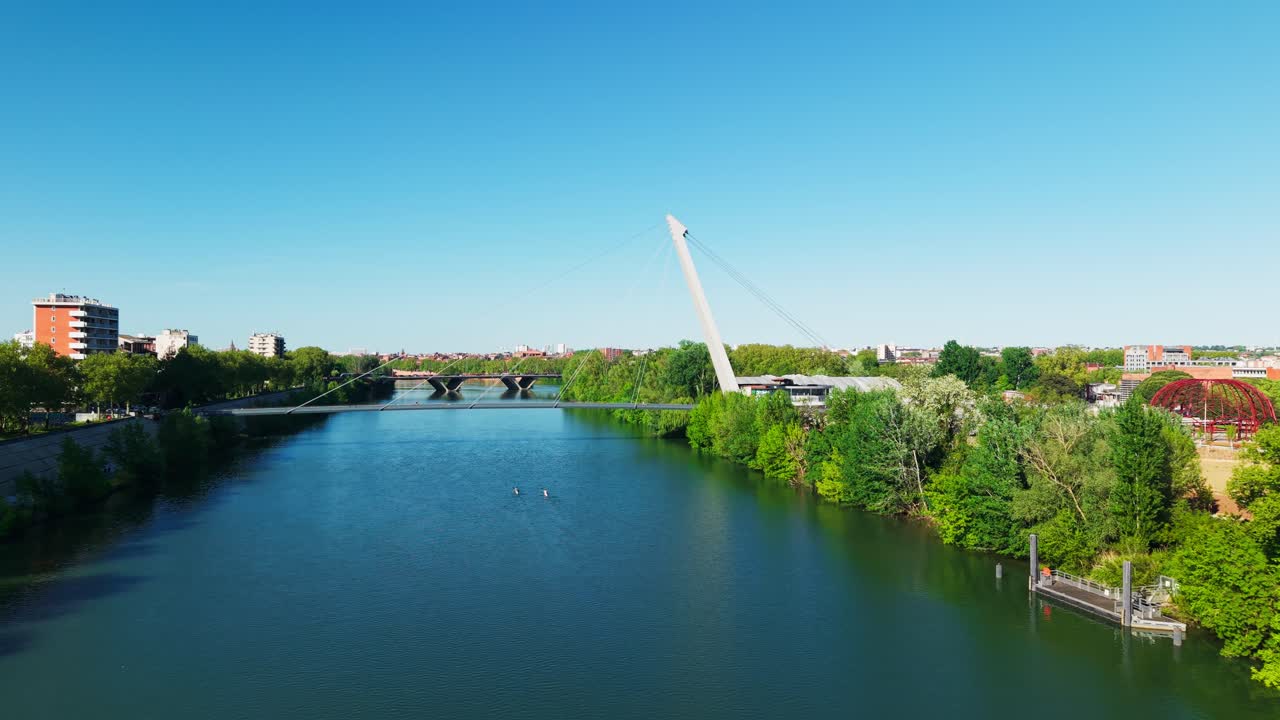 Drone flying over Garonne river and bridge in Toulouse France