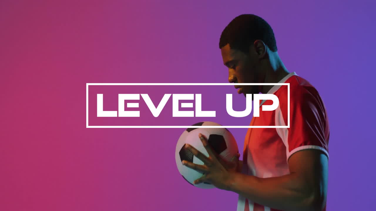 Holding soccer ball, man with Level Up text on colorful animation background
