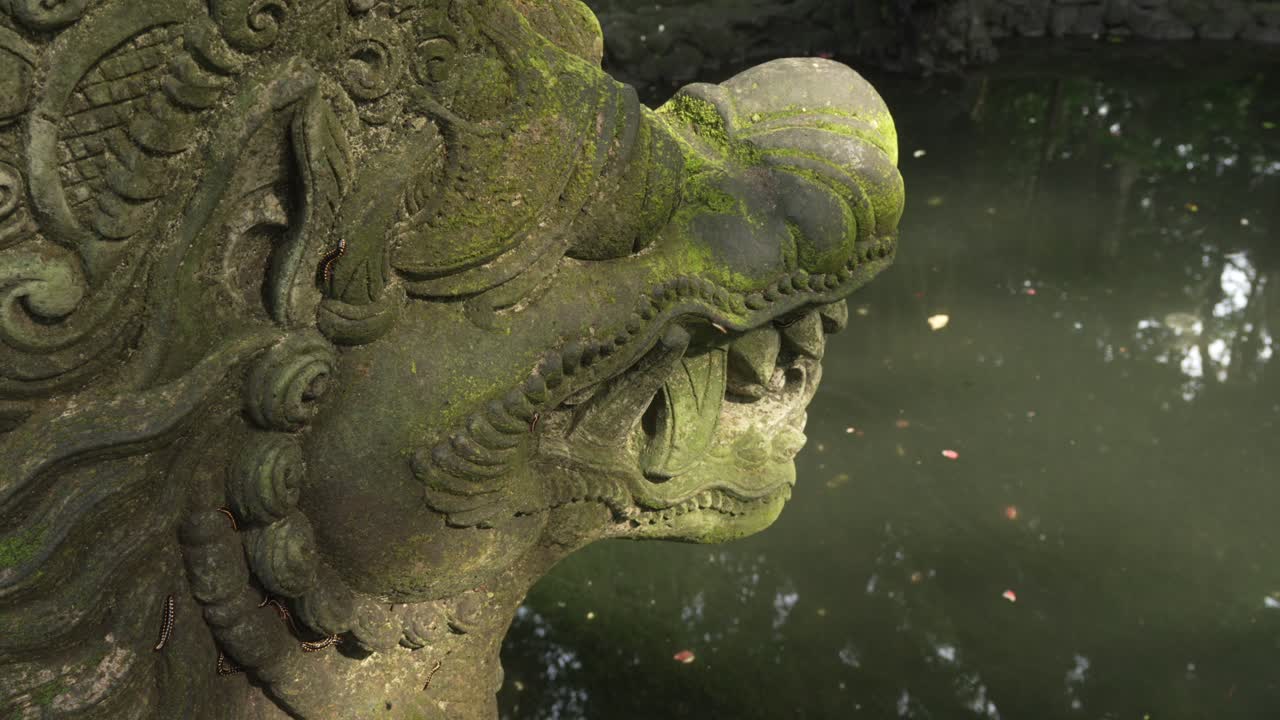 Balinese culture heritage dragon religious sculpture Bali Monkey forest Ubud Indonesia