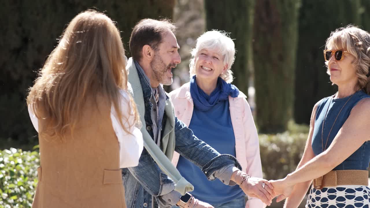 Mature people posing while recording a video together