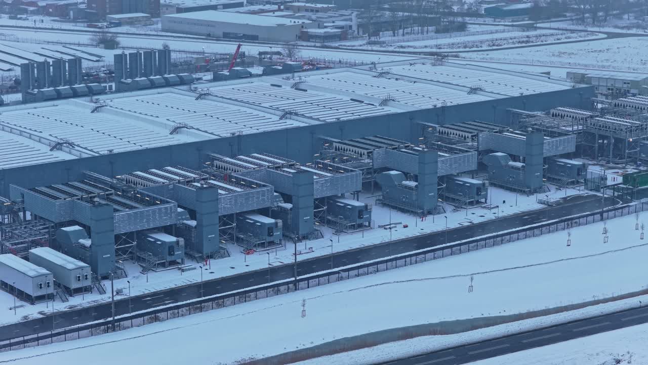 Aerial view of large data center under construction in winter