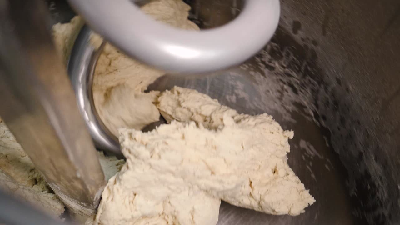 Dough being mixed in a commercial mixer