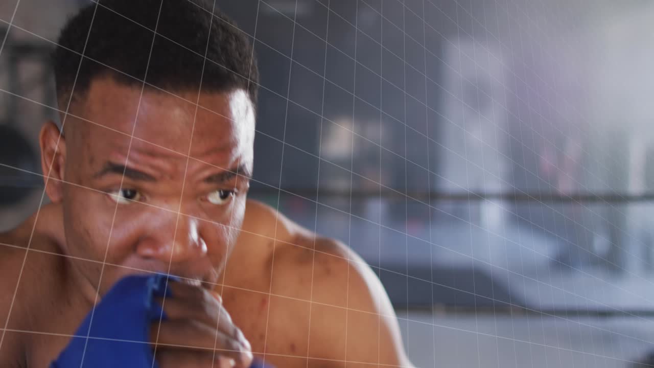 Boxer with blue wraps shifting in ring, green bar-line graph activating on motion data for training