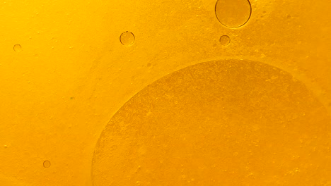 fondo de burbujas de petróleo de oro que humean y giran