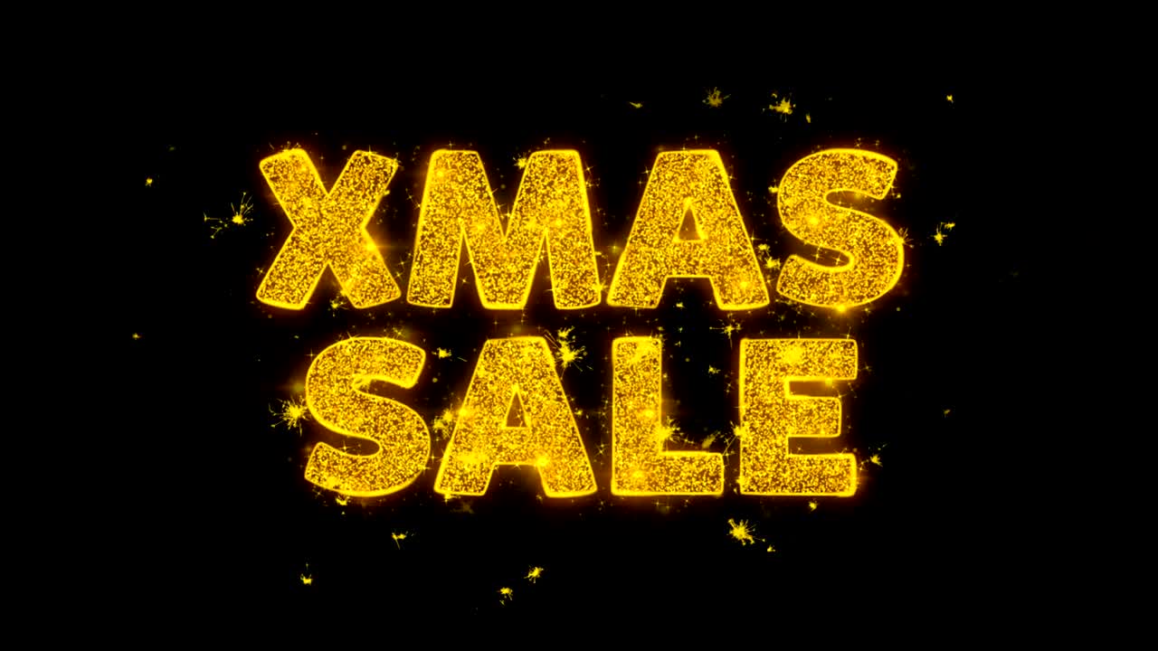 el texto de la venta de navidad hace chispas en el fondo negro.