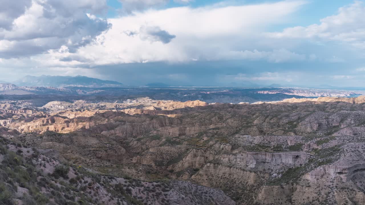Clouds casting shadows over desert canyon in Gorafe