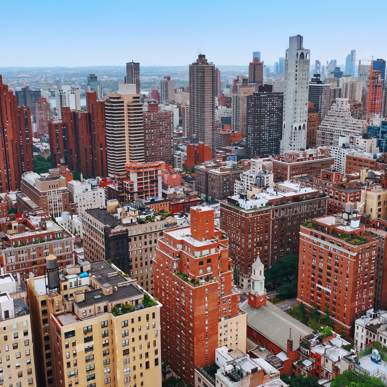 Colorful bright cityscape of New York. Drone footage above the metropolis panorama at daytime
