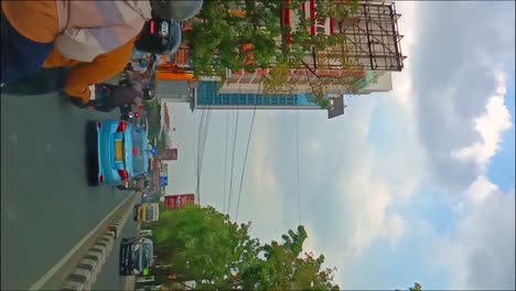 road traffic atmosphere in downtown bandung, indonesia. vertical view.