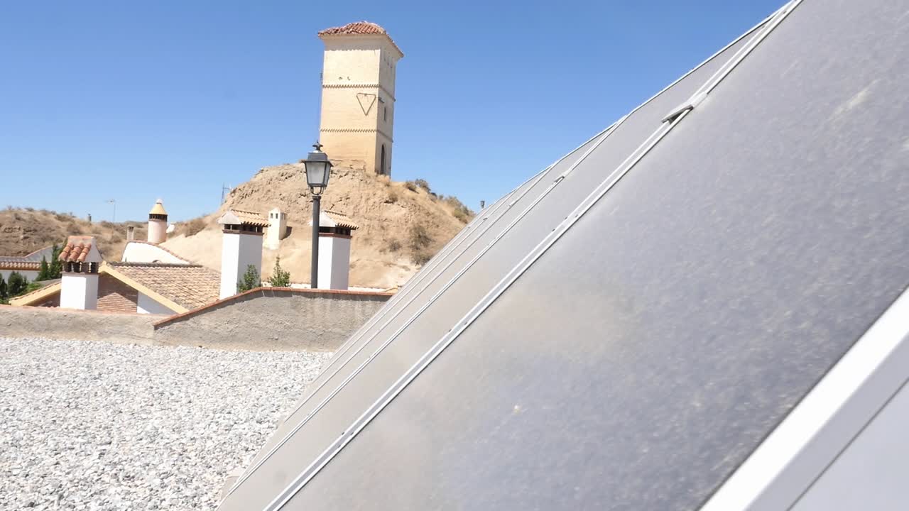 A dusty or dirty solar panel installed on a roof. Dust affects energy efficiency