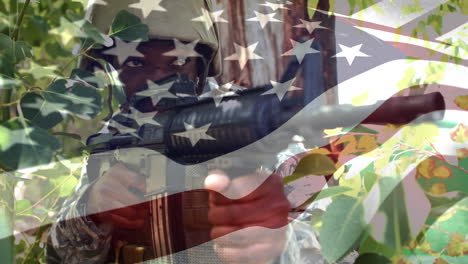 animation of flag of usa over african amercian soldier with machine gun