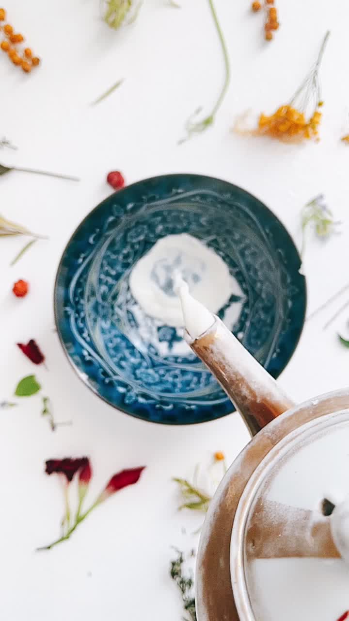 Pouring Milk into a Dish with Flowers
