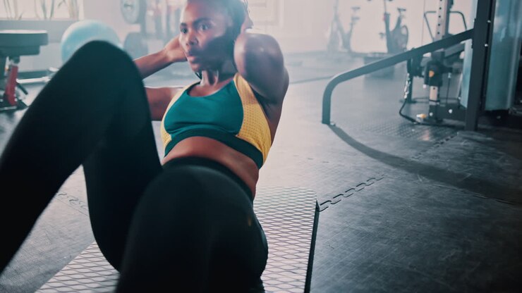 Woman Doing Crunches in a Gym