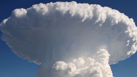 massive cloud formation against a blue sky