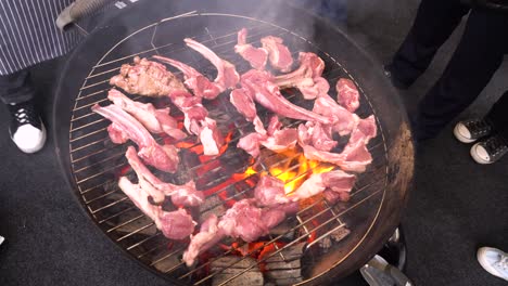 grilled lamb ribs on a charcoal grill