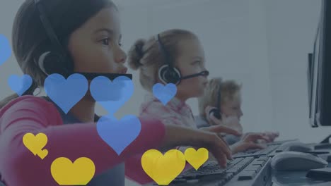 Animation-of-hearts-over-diverse-children-using-phone-headsets-in-office