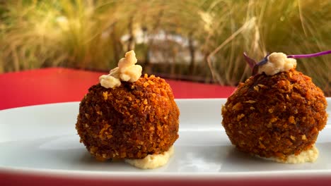 traditional spanish croquettes, tasty and crispy breaded starter dish in a restaurant, 4k shot