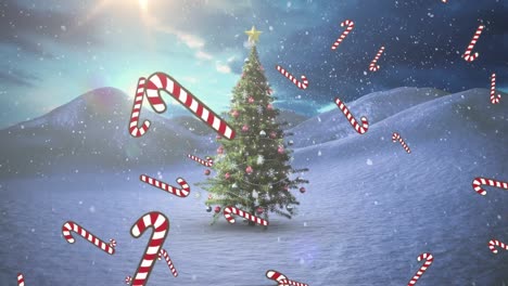 animación de nieve cayendo y bastones de caramelo sobre el árbol de chritmas en el paisaje de invierno