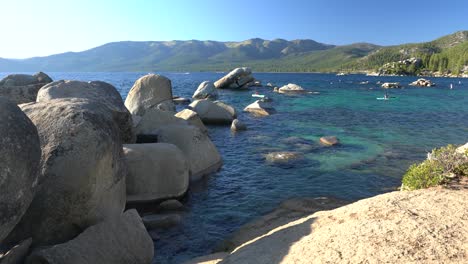 the iconic white rocks and crystal blue water at sand harbor beach state park in north lake tahoe