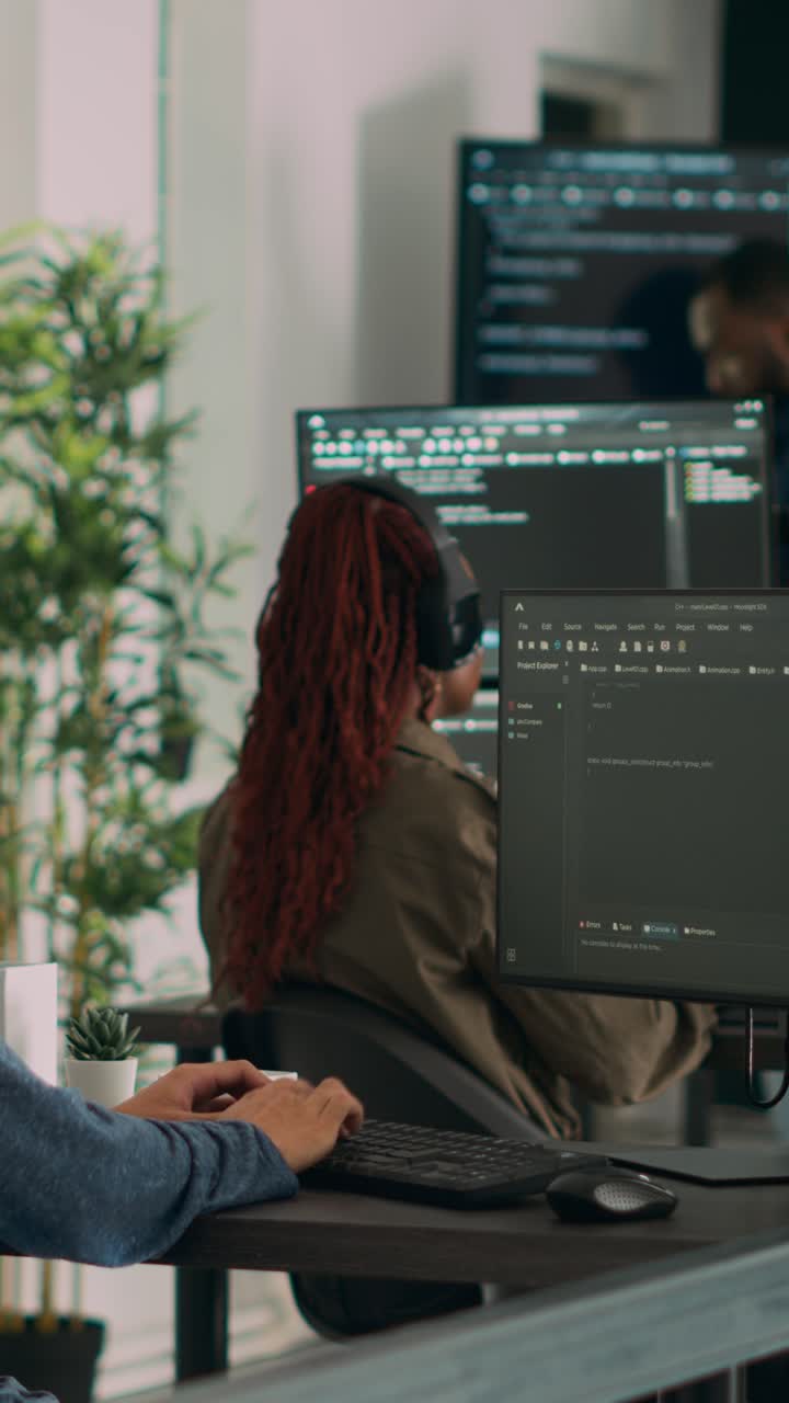 Vertical video: Asian software programer writing code on computer
