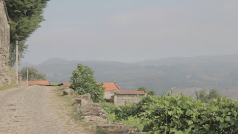 Pan-in-to-the-mountains-in-a-rural-village-on-a-hill-Friaes-Tras-os-Montes-Portugal