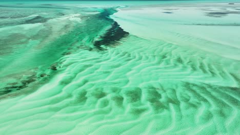 aerial perspective of white ripples on turquoise flat in bahamas