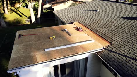 aerial gimbal tilt over a repairing roof