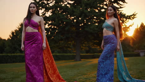 two women in traditional southeast asian clothing