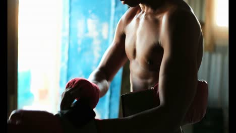 african american male boxer wearing boxing gloves in fitness studio 4k