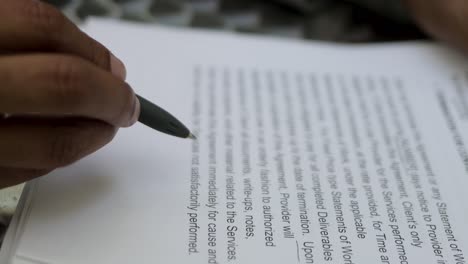 closeup shot of male hands signing documents