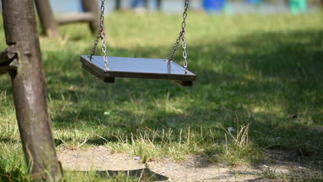 empty swing on playground in park