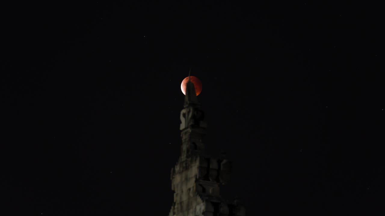Red Moon Eclipse over a Tower