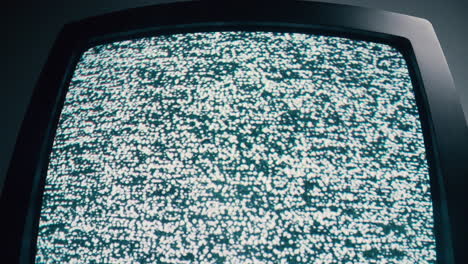 retro: classic tv screen displaying monochrome static noise, symbolizing retro technology and media interruption