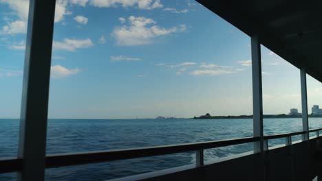 Ocean-ripples-with-small-waves-as-large-boat-cruises-through-the-sea