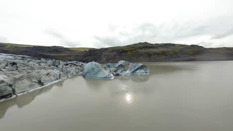 aerial fpv shot through a melting iceberg at fjallsárlón in iceland