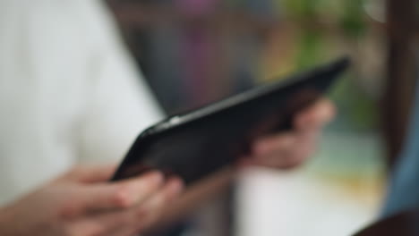 foggy closeup of hand pressing touchscreen device with subtle blur effect conveying motion and focus on digital interaction in soft illuminated environment capturing tactile gesture and modern tech usage scenario