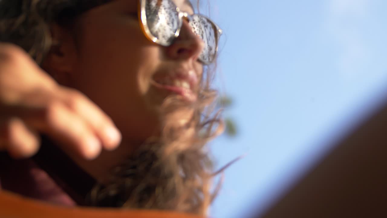 Closeup Of A Young Girl Who Sings While Playing The Guitar Outdoor.