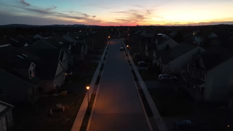 Drone-descending-wide-shot-of-lighting-streetlamps-in-american-residential-area